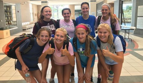 Girls joust during volleyball tryouts