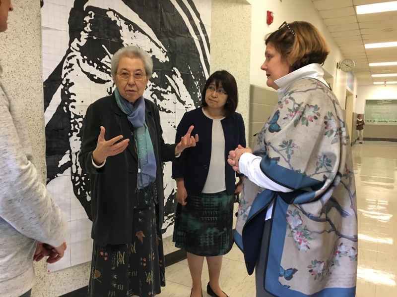 Principal Jennifer Sudekum took Sr. Madeline Marie and Mrs. Iseki on a tour of the school. Here they speak with teachers on the theology wing.