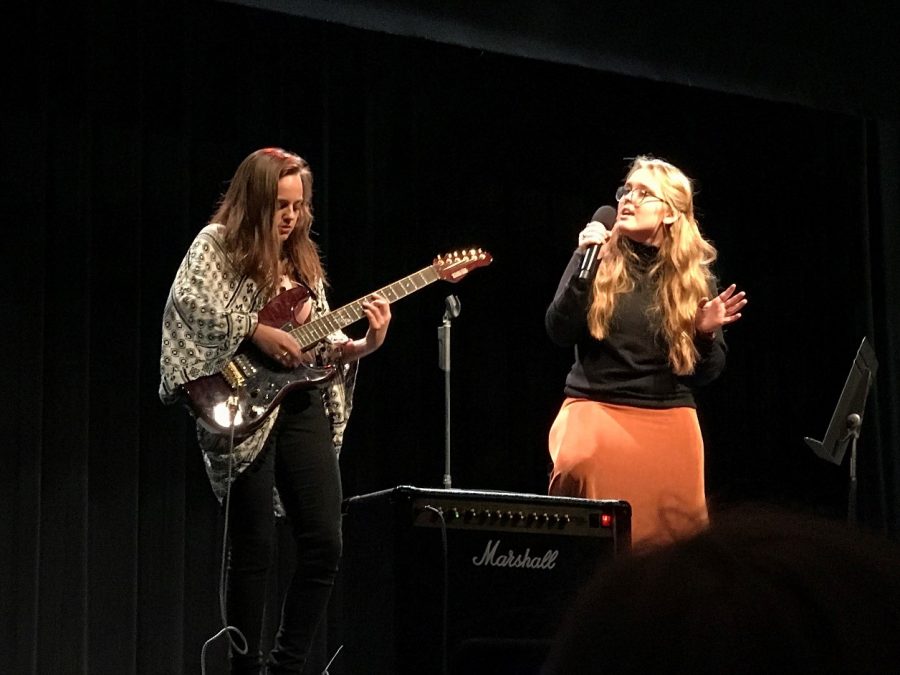 Seniors Chickie Slane (left) and Jordyn Piercy (right) perform the song “Valerie” at Music for the Missions. 