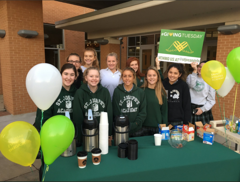 Sophomore angels (back row:  Grace Aromando, Emma Mcmullen, Olivia Sullivan, Allie Westphale, and Katie Young and front row:  Maggie Keusenkothen, Grace Schad, Sophie Devlin, Katie Wells, and Morgan Jarman ) pass out coffee to parents on Giving Tuesday.