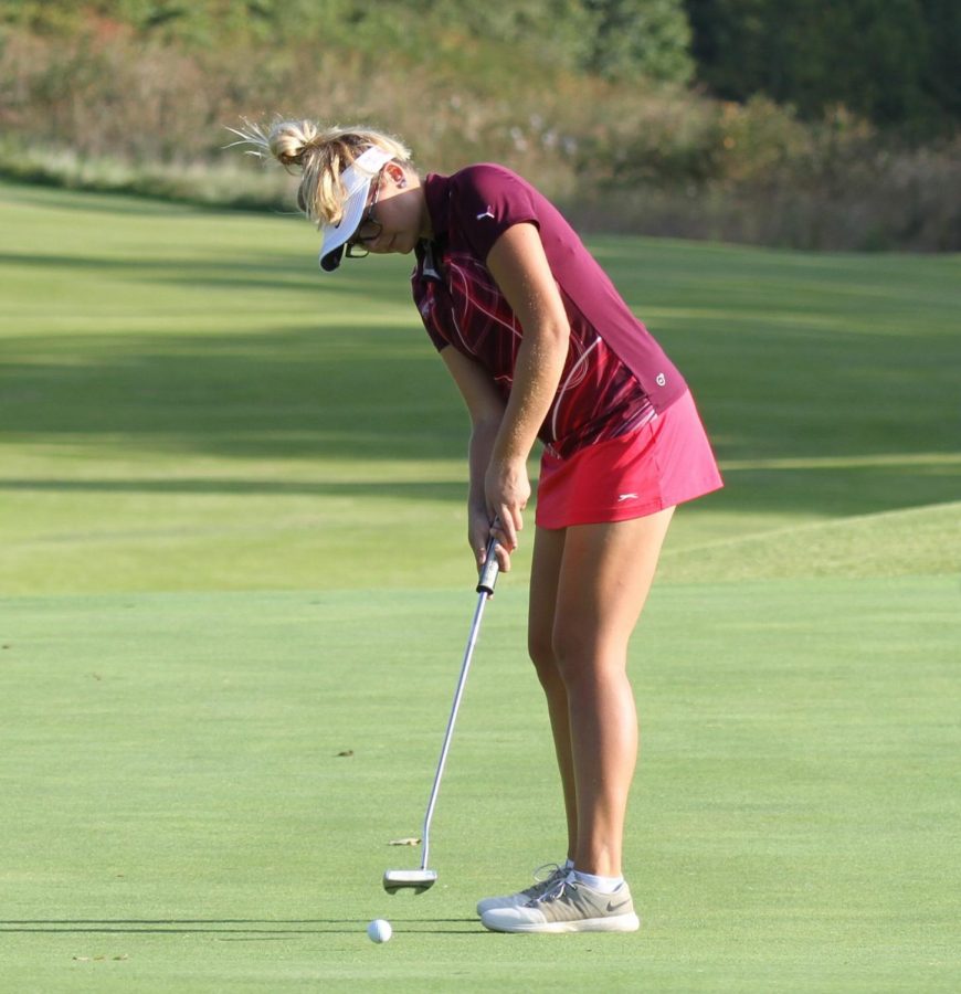 Grace Aromando swings during a St. Joe golf tournament.