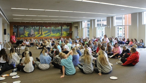 The junior class listens attentively as Dan Huss, youth minister at Incarnate Word, speaks at the retreat. Photo taken by Mallory Kimes. 