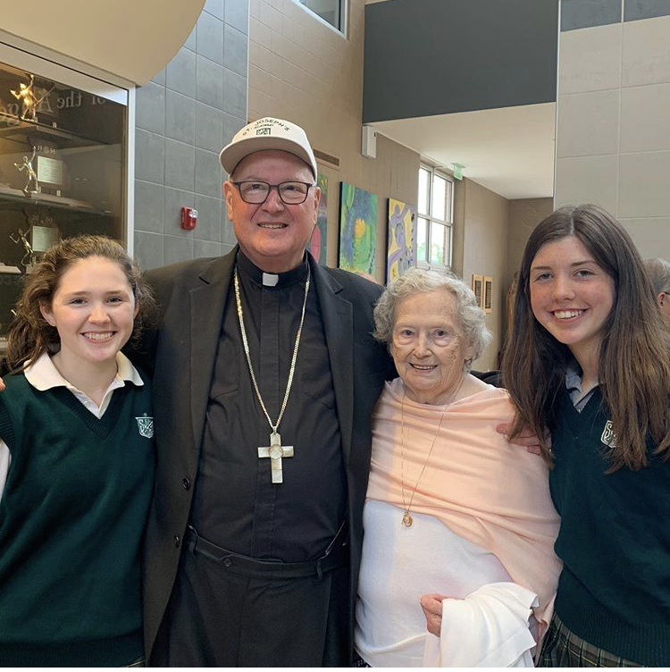 (Left)Grace Dolan 20, Cardinal Dolan, Grace and Kathleens Grandma, and Kathleen Dolan 23 (right) enjoying refreshments after mass. 
