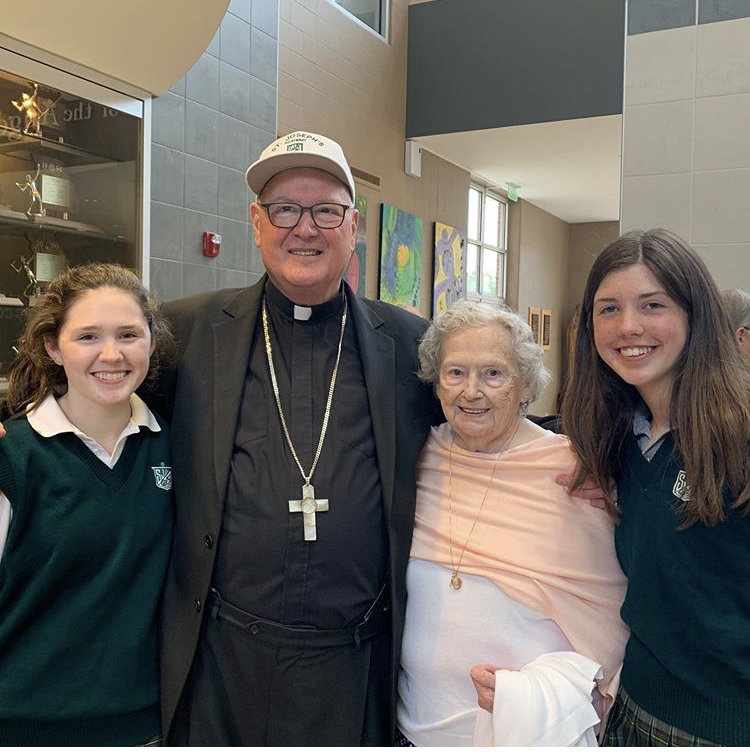 (Left)Grace Dolan '20, Cardinal Dolan, Grace and Kathleen's Grandma, and Kathleen Dolan '23 (right) enjoying refreshments after mass. 