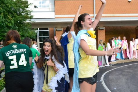 Seniors Victoria Unnerstal (left), Katherine Chalmers (right), and their classmates welcome the underclassmen on St. Joe day.