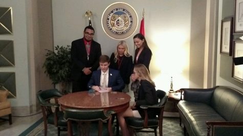 Olivia Staph and Kara Greger get their bill signed into law!