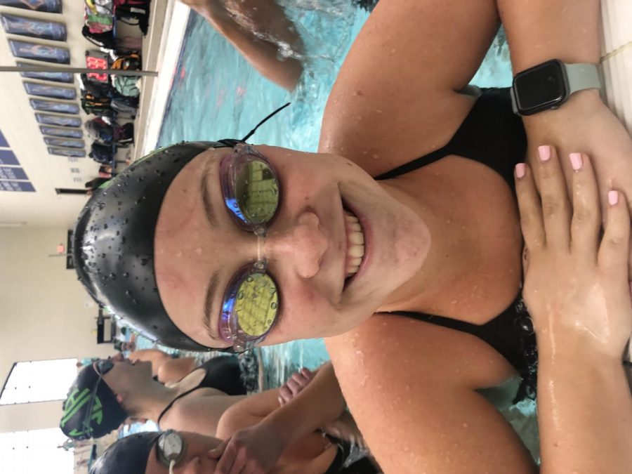 Junior Libby Shuman always brings a smile with her to swim practice.