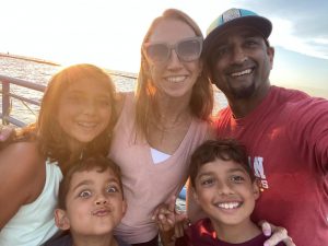 Ms. Shah, her husband, and their three kids while traveling over the summer. 