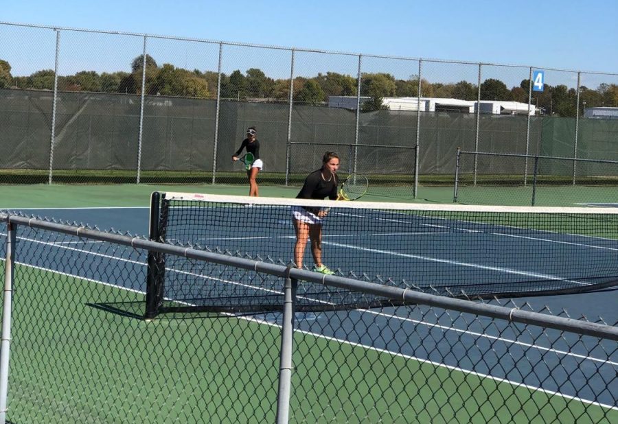 Abby Gaines taking a serve at state.