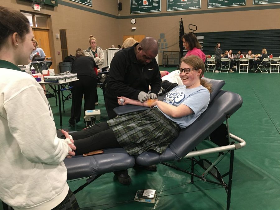 In 2019, Nicole Bergen donated blood while a supporting upperclassman cracked a joke.