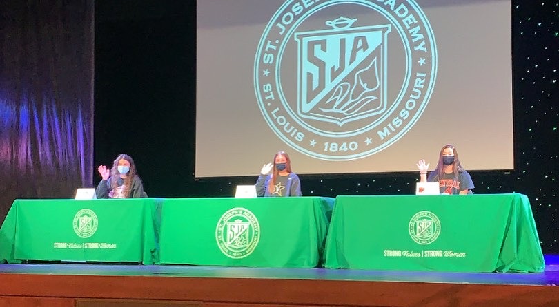 Seniors (from Left to Right) Kara Hauser, Emma Mueller, and Nicole Rallo signing their Nation Letter of Intent in the SJAs theatre on November 11.