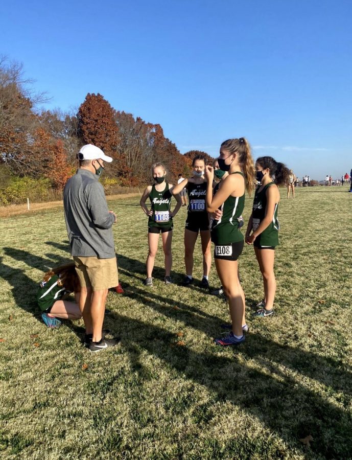 Coach Scott House talking to the girls before a race. 