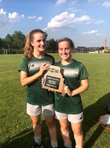 Ella Kertz (right) and her twin sister Grace Kertz (left) after winning first place in the district championship in 2019