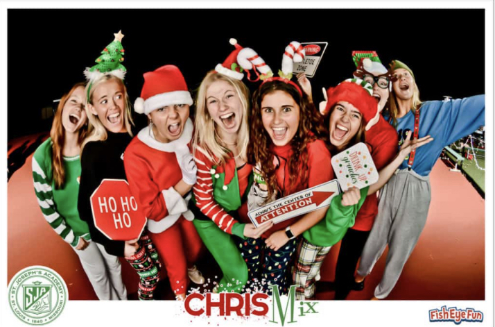 Seniors Sarah Miner, Lily Skaggs, Kelsey Kimes, Emily Metherd, Sydney Schlanger, Lexi Hartman, Kelly Dean, and Kelsey Everitt had fun at the photo booth during ChrisMix. 