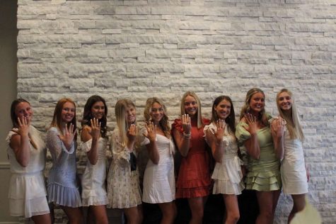 Seniors showing off their junior rings, and dresses from last years ceremony.