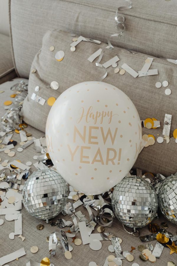 A balloon notes the start of a new year while surrounded by a New Years Eve mess!