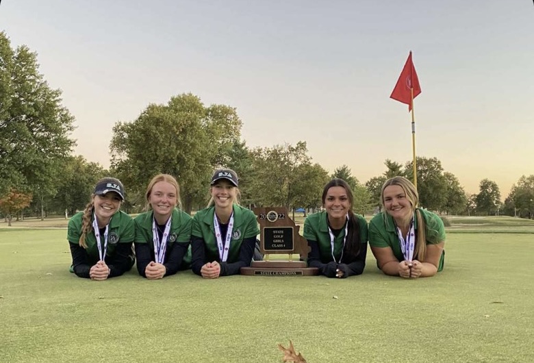 Left to right: Maggie Drozda, Bella Buckley, Rylie Andrews, Catherine Cronin, KC Lenox

The Varsity Golf Team poses with their State Championship Trophy
