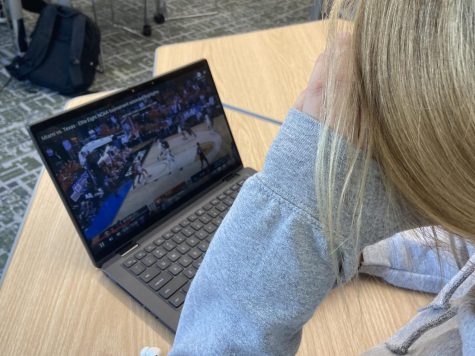 Sophomore Chelsea Lindell watches the Miami vs. Texas highlights from March Madness.