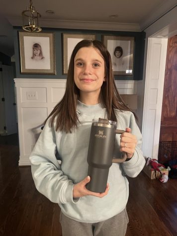 Sophomore, Jenna Akins, holding her 40oz Stanley Cup. 