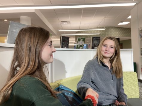 Sophomores Audrey Callen and Maddy Schlautman practice their handshaking skills for a job interview.