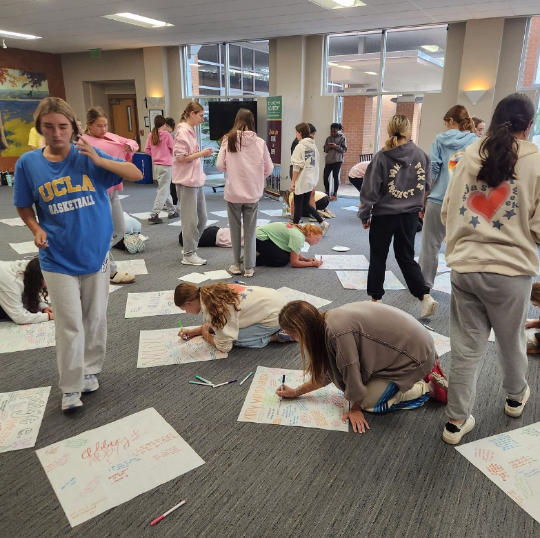 On their retreat day, junior students write notes of affirmation and gratitude to their classmates.