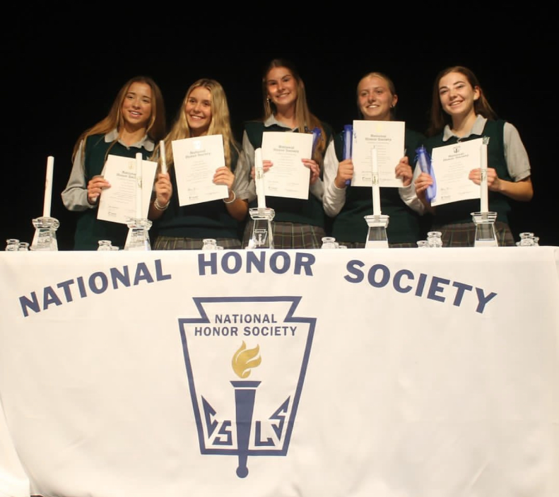 Junior NHS inductees smile after the completion of their induction ceremony. Juniors (left to right) Ella Cooper, Katie Hickman, Claire Bucher, Molly Pardeck, and Bella Elpers.