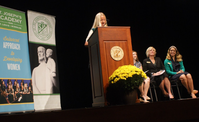Lauren Miner, the senior class president, delivers a speech at Senior Investiture.