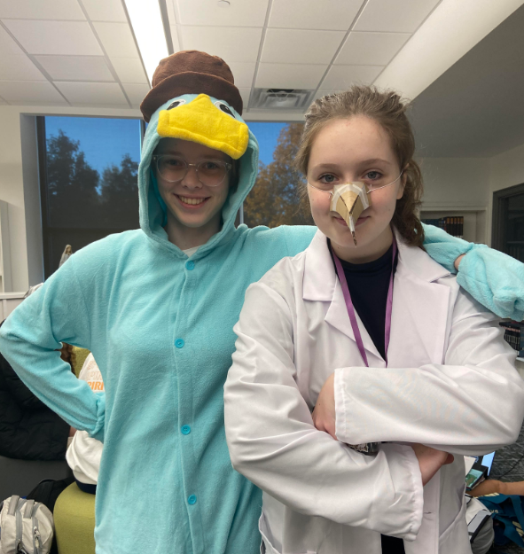 Cecil Simpson 26 and Cate Frew 26 show off their duo costume as Dr. Doofenshmirtz and Perry the Platypus.