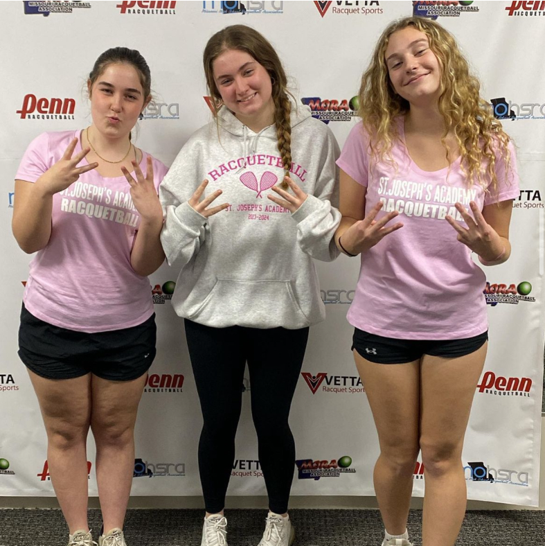 SJA racquetball Angels Lily Kaller (26), Grace Theissen (24), and Evelyn Muir (26) about to hit the courts for the Winter Classic!