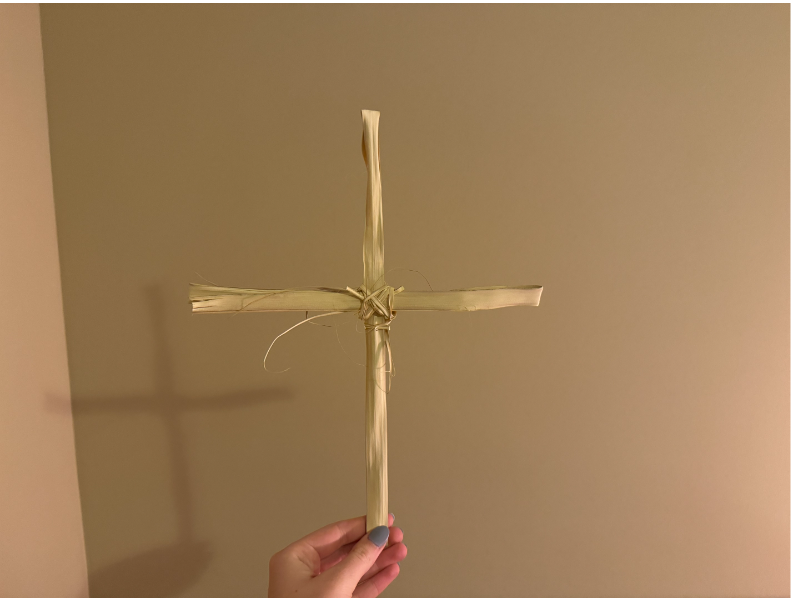 A handmade palm leaf cross from Palm Sunday reminds Catholics of the Lenten season.