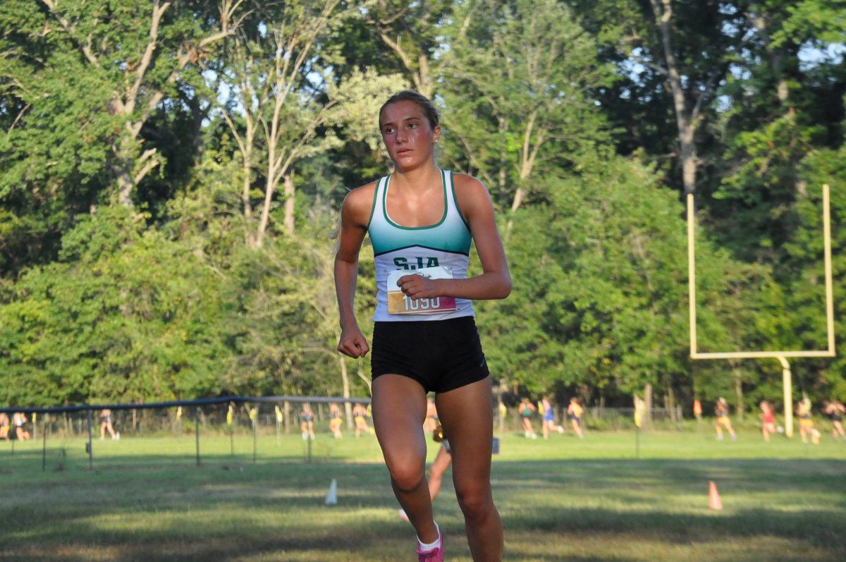 Junior Savannah Amann turns the corner as she heads toward the finish line.