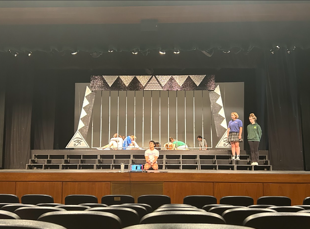 The cast of Joseph and the Amazing Technicolor Dream Coat performs a scene during rehearsal.