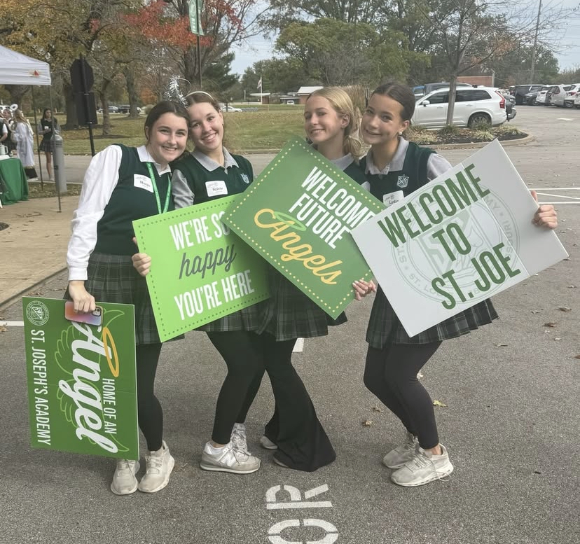 Group of SJA students welcome prospective families to St. Joe during Open House. 